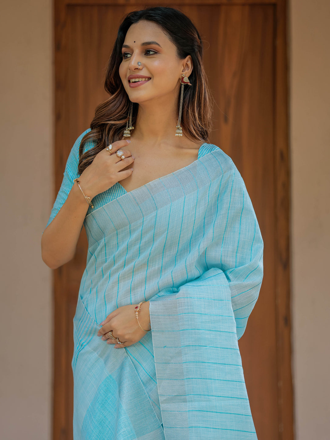 Aqua Blue Pure Handloom Cotton Saree with Striped Weaving & Tassel Detailing