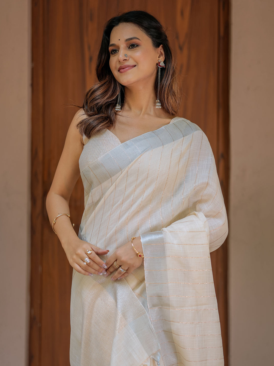 Ivory Cream Pure Handloom Cotton Saree with Golden Striped Weaving & Tassel Detailing