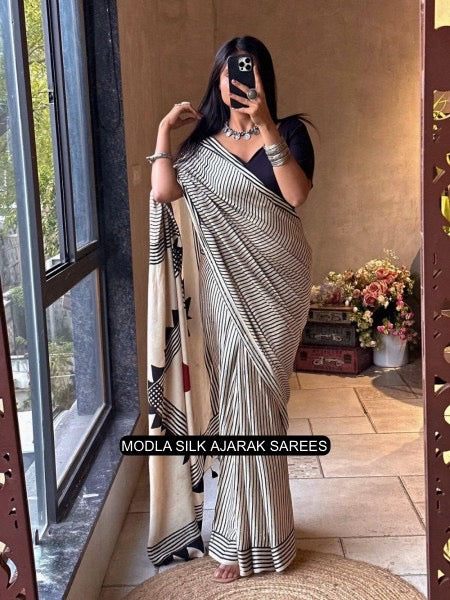 Ivory White &amp; Black Modal Silk Contemporary Ajrakh Saree with Geometric Stripe Pattern, Artistic Statement Pallu &amp; Tassel Detailing