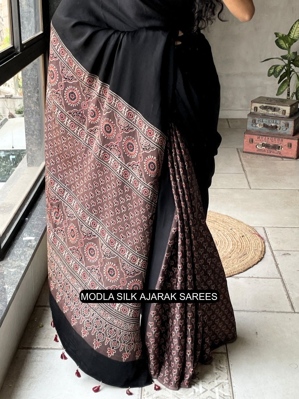 Black Modal Silk Ajrakh Printed Saree with Traditional Heritage Pallu, Intricate Ethnic Motifs &amp; Tassel Detailing