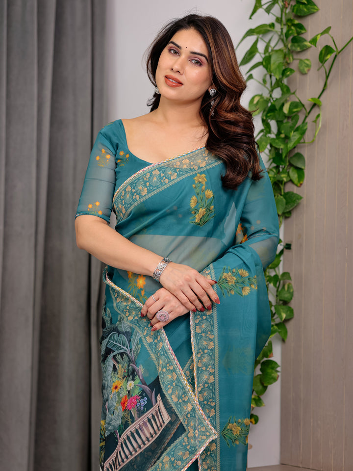 Teal Green Scenic Printed Organza Saree with Garden Pavilion Artwork Pallu | Designer Lightweight Organza Saree with Floral Motifs & Decorative Border | Festive & Party Wear Saree with Blouse Piece