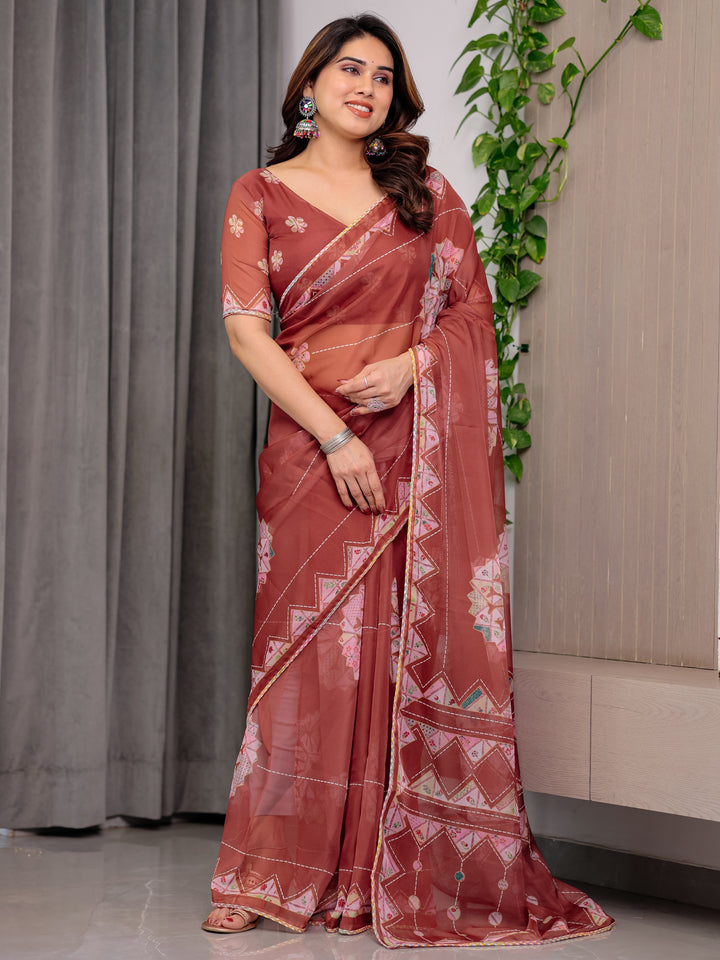 Rust Terracotta Printed Organza Saree with Mandala Motifs & Geometric Border | Designer Lightweight Organza Saree with Multicolour Lace Edge | Festive & Party Wear Saree