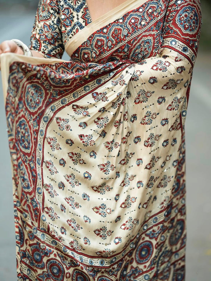 Ivory Modal Silk Ajrakh Printed Saree with Traditional Floral Motifs, Heritage Border &amp; Tassel Detailing