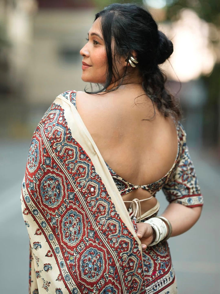 Ivory Modal Silk Ajrakh Printed Saree with Traditional Floral Motifs, Heritage Border &amp; Tassel Detailing