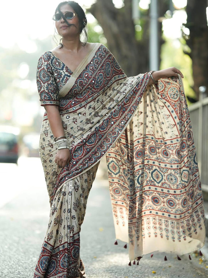 Ivory Modal Silk Ajrakh Printed Saree with Traditional Floral Motifs, Heritage Border &amp; Tassel Detailing